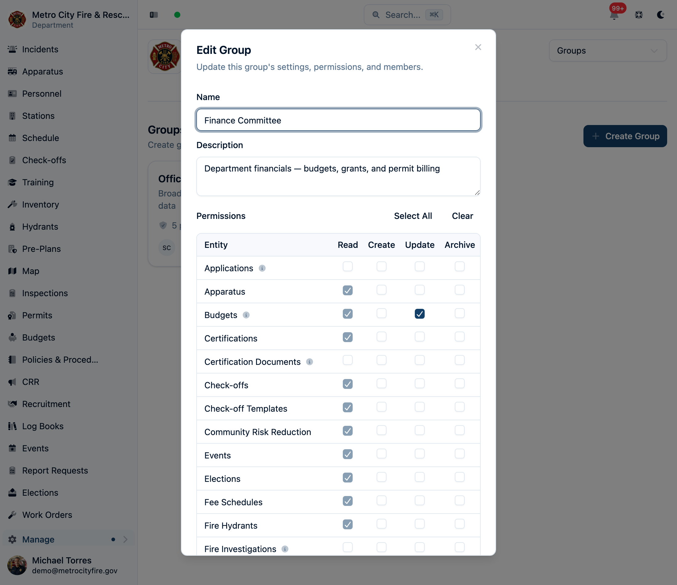 Editing a Finance Committee group: the Budgets row's Update grant is checked, and its Read checkbox is checked and locked because edit access already includes viewing