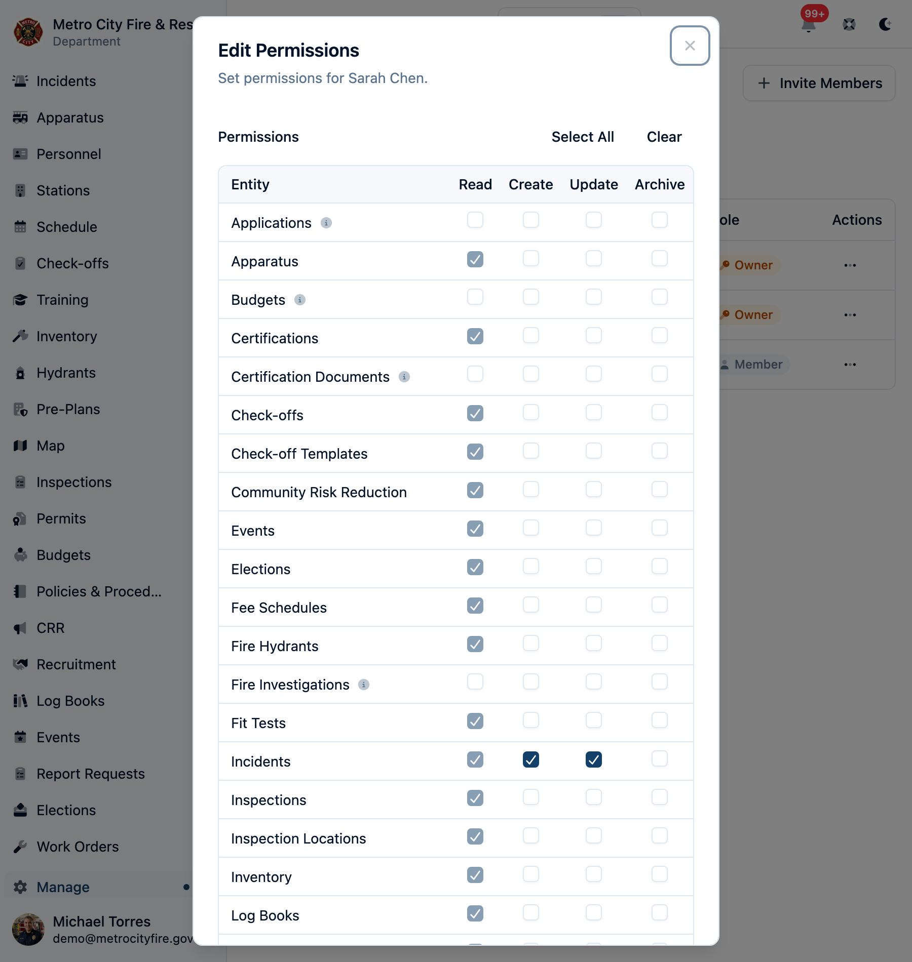The Edit Permissions dialog for a member: most rows show a locked, checked Read box because all members can view them, while restricted rows like Applications, Budgets, and Fire Investigations have a togglable Read checkbox
